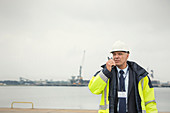 Dock manager using walkie-talkie at commercial dock