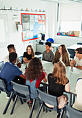 Students talking during debate class in classroom