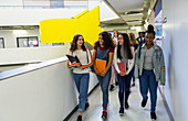 Junior high girl students walking in corridor