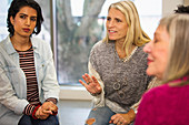 Women talking in support group meeting circle