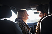 Young couple talking in car