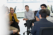 Business people meeting in a circle in office