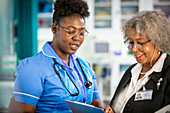 Female doctor and nurse talking