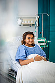 Portrait girl patient in hospital bed