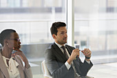 Business people listening in conference room meeting
