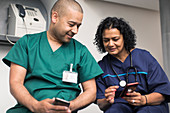 Doctor and surgeon using smart phones