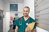 Portrait male surgeon in hospital corridor