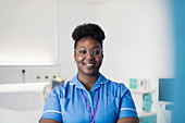 Portrait confident, female nurse in hospital