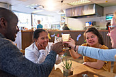 Happy young women with Down Syndrome in cafe