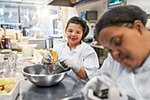 Portrait young woman with Down Syndrome cooking in cafe