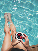 Woman relaxing, dipping bare feet