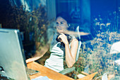 Businesswoman with headset working in home office