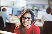 Businesswoman with headset working in office