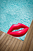 Inflatable lips in corner of summer swimming pool