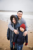 Family with Down Syndrome child on beach