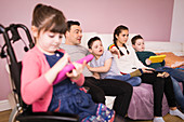 Family with Down Syndrome child watching TV