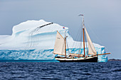 Ship sailing along iceberg formation