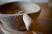 Close up rustic wooden bowl with handle