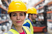 Portrait confident female worker in warehouse