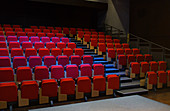Red seats in empty auditorium