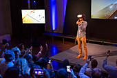 Audience watching speaker with virtual reality glasses
