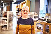 Portrait happy senior woman shopping in home goods store