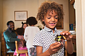 Eager boy eating decorated Halloween cupcake