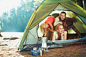 Playful family inside of tent