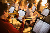 Trombonist performing in orchestra