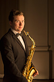 Portrait of saxophonist in tuxedo