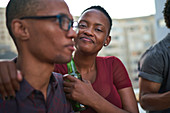 Portrait happy young couple drinking beer