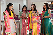 Happy multigenerational Indian women in traditional saris
