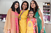 Happy multigenerational Indian women in traditional saris