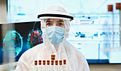 Female scientist in clean suit studying coronavirus vaccine