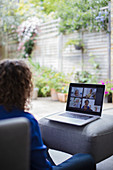 Senior women friends video conferencing on laptop screen