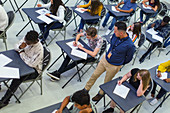 Teacher supervising students taking exam