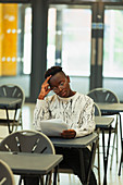Focused boy student taking exam