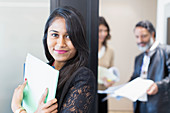 Businesswoman standing outside meeting