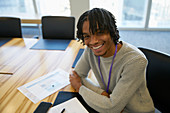 Businessman with paperwork in conference room