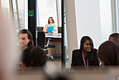 Businesswoman with paperwork in conference room