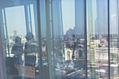 Reflection of city in highrise office window