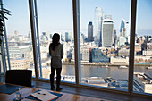 Businesswoman looking at cityscape view