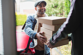 Delivery man delivering pizzas at front door