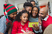 Happy family taking Christmas selfie