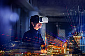 Smiling businesswoman using VR glasses