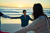 Family holding hands in circle