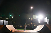 Young man skateboarding on ramp