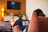 Woman with dog video chatting with friends