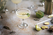 Ginger lime cocktail with herb garnish