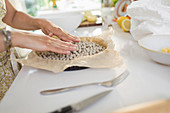 Woman blind baking pie crust with pie weights